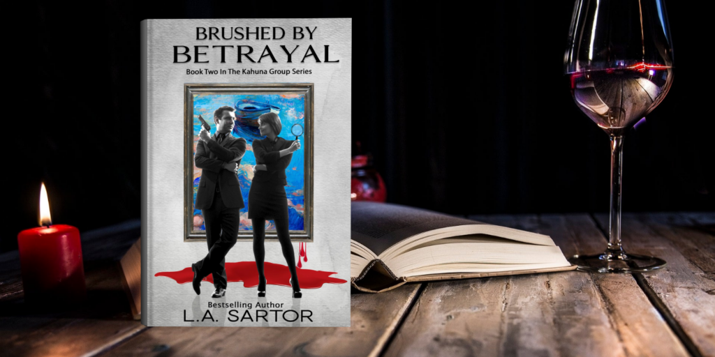 L.A. Sartor's Suspense Brushed By Betrayal on desk with a candle and glass of red wine